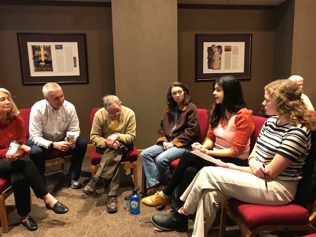 St. Olaf students in dialogue with older adults in small group discussion.